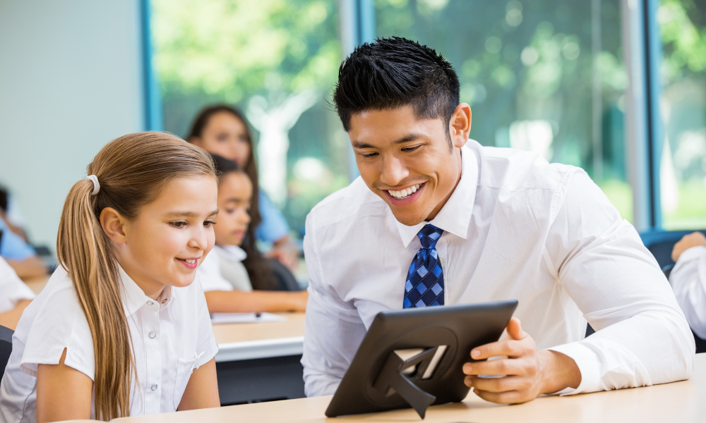 students in a classroom with technology