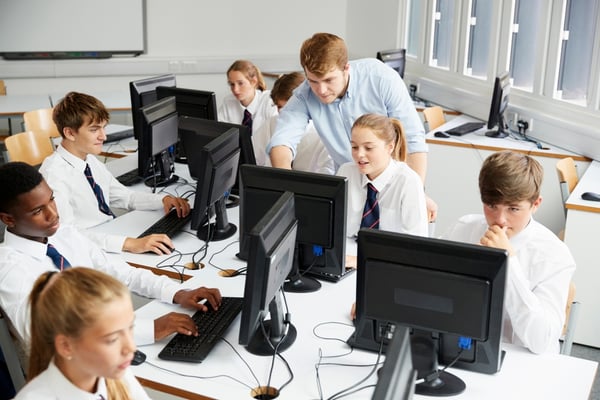 ICT efficiencies: IT manager with secondary pupils